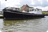 Varend Woonschip Conrad Logger met Varend - motorboot